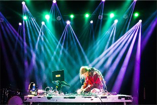Stage lighting over a DJ booth