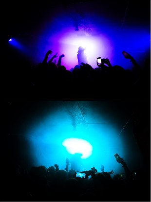 Crowd silhouettes in blue light